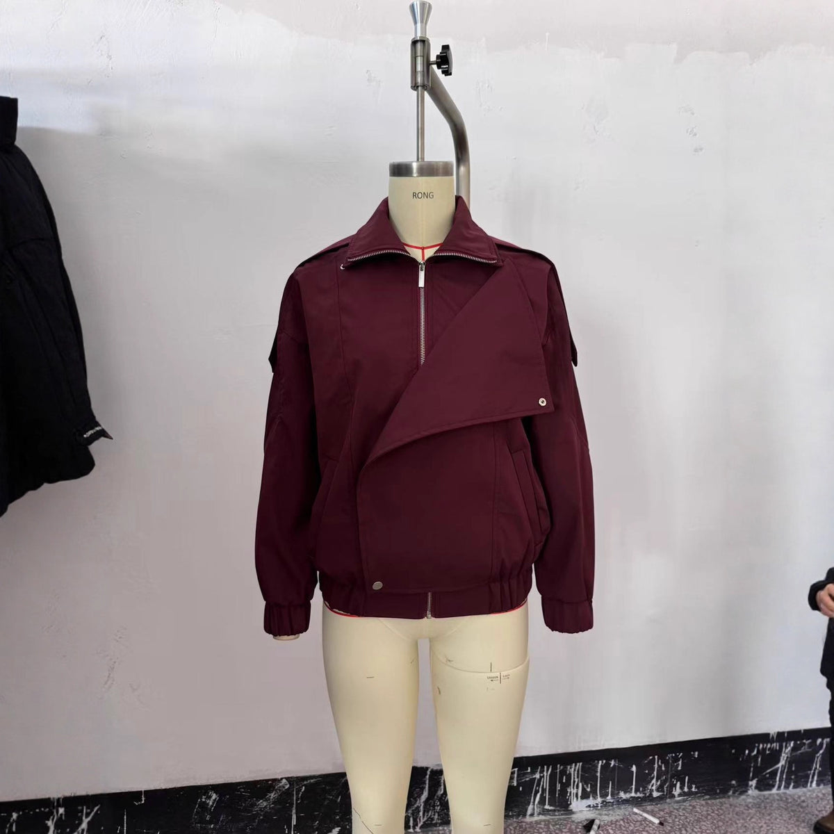 Women's oversized bomber jacket with asymmetric placket front, standing collar, and drawstring hem Fashion Glam