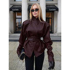 Women's leather look jacket with fitted belt and high stand-up collar Fashion Glam