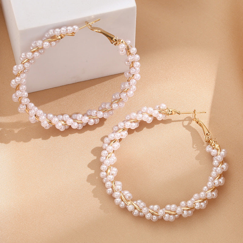 Ladies hoop earrings with luxurious pearl accents and elegant, twisted design Fashion Glam