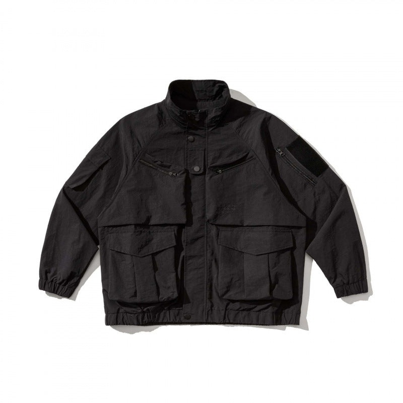 Unisex Oversize Utility Jacket with multifunctional pockets, high stand-up collar, and elastic hem Fashion Glam