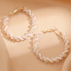 Ladies hoop earrings with luxurious pearl accents and elegant, twisted design Fashion Glam