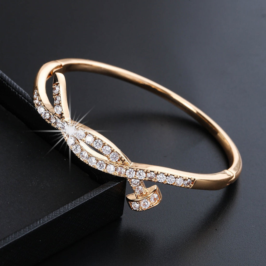 Women's bangle with elegant infinity pattern and sparkling zirconia Fashion Glam