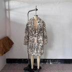 Women's midi coat made of faux fur with leopard print, oversized fit and shawl collar Fashion Glam