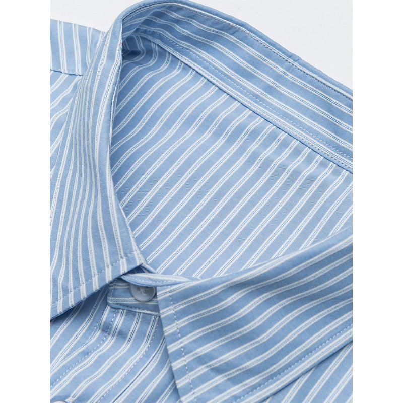 Women's oversized shirt with fine stripes, breast pocket, and rounded hem Fashion Glam