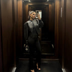 Women's short jacket in biker-bomber style made of vegan leather with a stand-up collar and oversized sleeves Fashion Glam