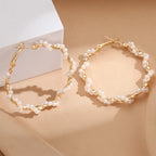Ladies hoop earrings with luxurious pearl accents and elegant, twisted design Fashion Glam