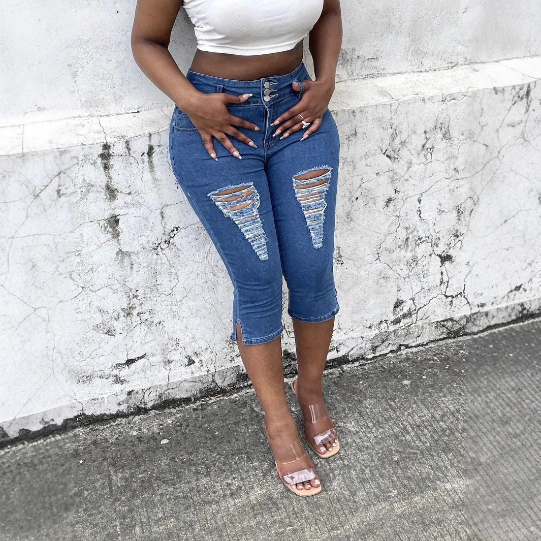 Women's high-waisted, three-quarter length stretch jeans with destroyed inserts and side seam slit Fashion Glam