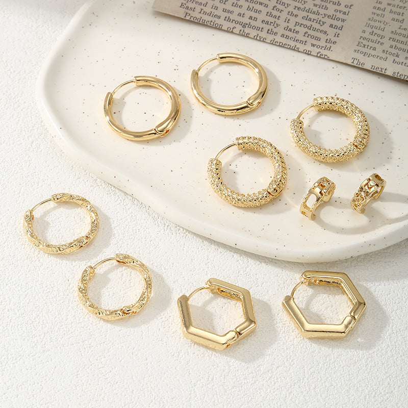 Women's hoop earrings with modern, textured design Fashion Glam