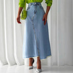 Ladies High-Waisted Maxi Denim Skirt with Asymmetrical Front Seam and Frayed Hem Fashion Glam