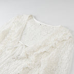 Ladies figure-hugging lace blouse with ruffle V-neck and tie detail Fashion Glam