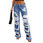Women heavily distressed flared jeans with wide legs and ripped inserts Fashion Glam
