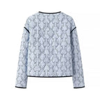 Women's lightweight quilted blouse jacket with V-neck, contrast piping and floral line print Fashion Glam