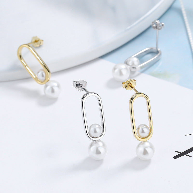 Women's stud earrings with modern oval design and elegant pearls Fashion Glam