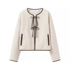 Women's short jacket in teddy look with decorative ribbons and contrasting piping Fashion Glam