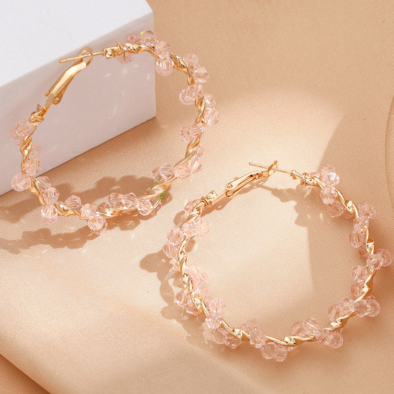 Ladies hoop earrings with luxurious pearl accents and elegant, twisted design Fashion Glam