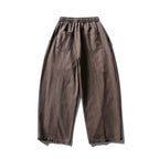 Unisex wide balloon pants made of cotton blend with drawstring waistband and decorative darts Fashion Glam