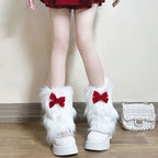 Ladies cozy boot cuffs made of faux fur with bow appliqué and pompons Fashion Glam
