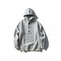 Unisex knitted hoodie with half placket, ribbed hem and double-layer finish Fashion Glam