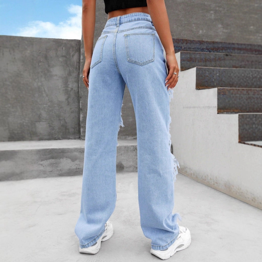 Women high-cut heavily ripped denim jeans with wide leg and decorative seam panels Fashion Glam