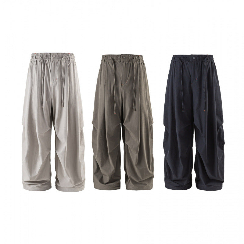 Unisex Loose-fitting technical cargo pants with elastic waistband, drawstring, and zip pockets Fashion Glam