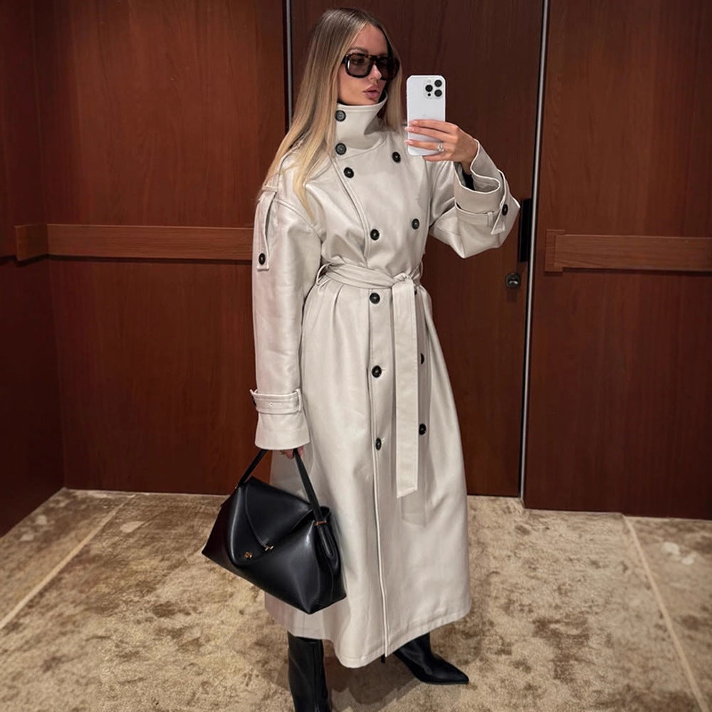 Women's long leather look trench coat with high stand-up collar, waistband and double-breasted button placket Fashion Glam
