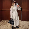 Women's long leather look trench coat with high stand-up collar, waistband and double-breasted button placket Fashion Glam