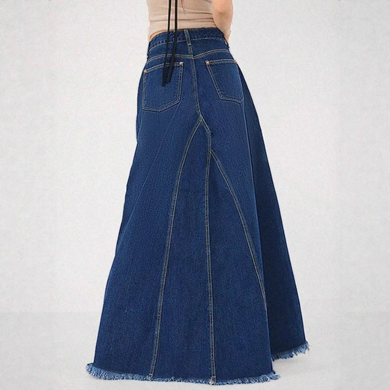 Women’s high-waisted A-line denim maxi skirt with decorative seams and raw fringe hem Fashion Glam