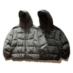 Unisex Oversize quilted jacket in boxy cut with hood and adjustable hem Fashion Glam