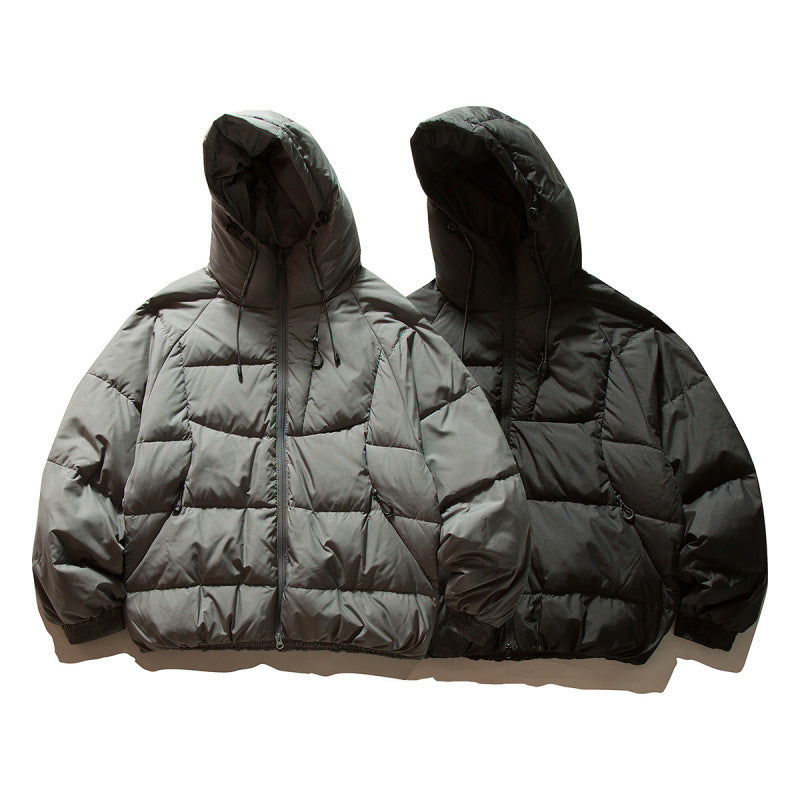 Unisex Oversize quilted jacket in boxy cut with hood and adjustable hem Fashion Glam