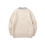 Unisex chunky knit boxy sweater with V-neck and contrasting polo button collar Fashion Glam