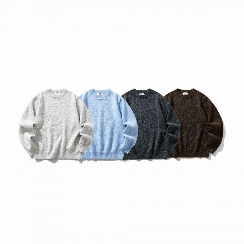 Unisex Oversize fine knit sweater with round neckline, ribbed cuffs, and mottled wool blend Fashion Glam
