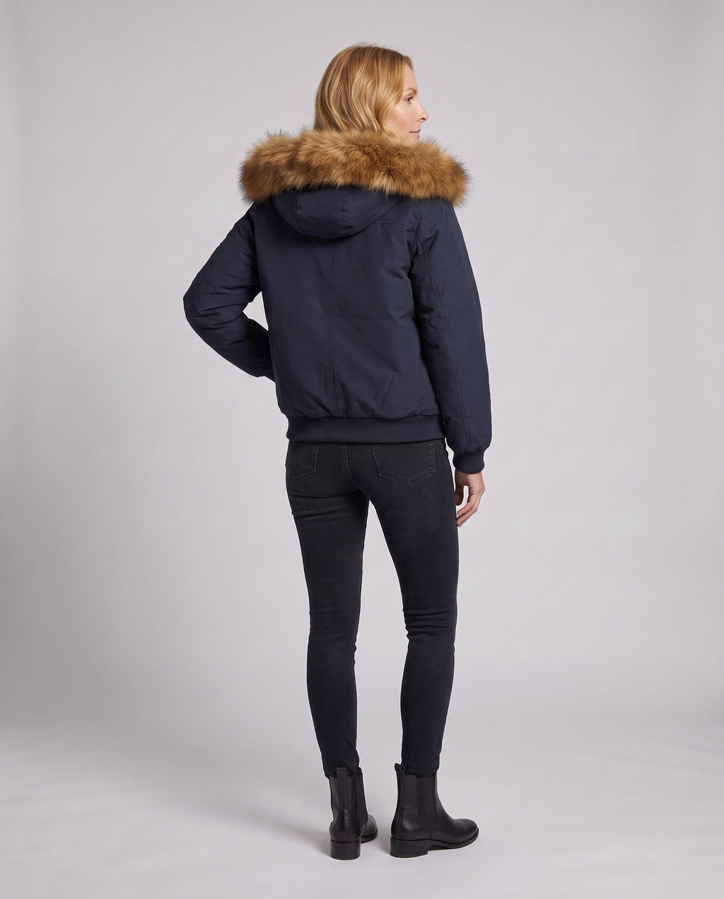 Women's short urban thermal parka with detachable faux fur trim, raglan sleeves, and concealed two-way zipper