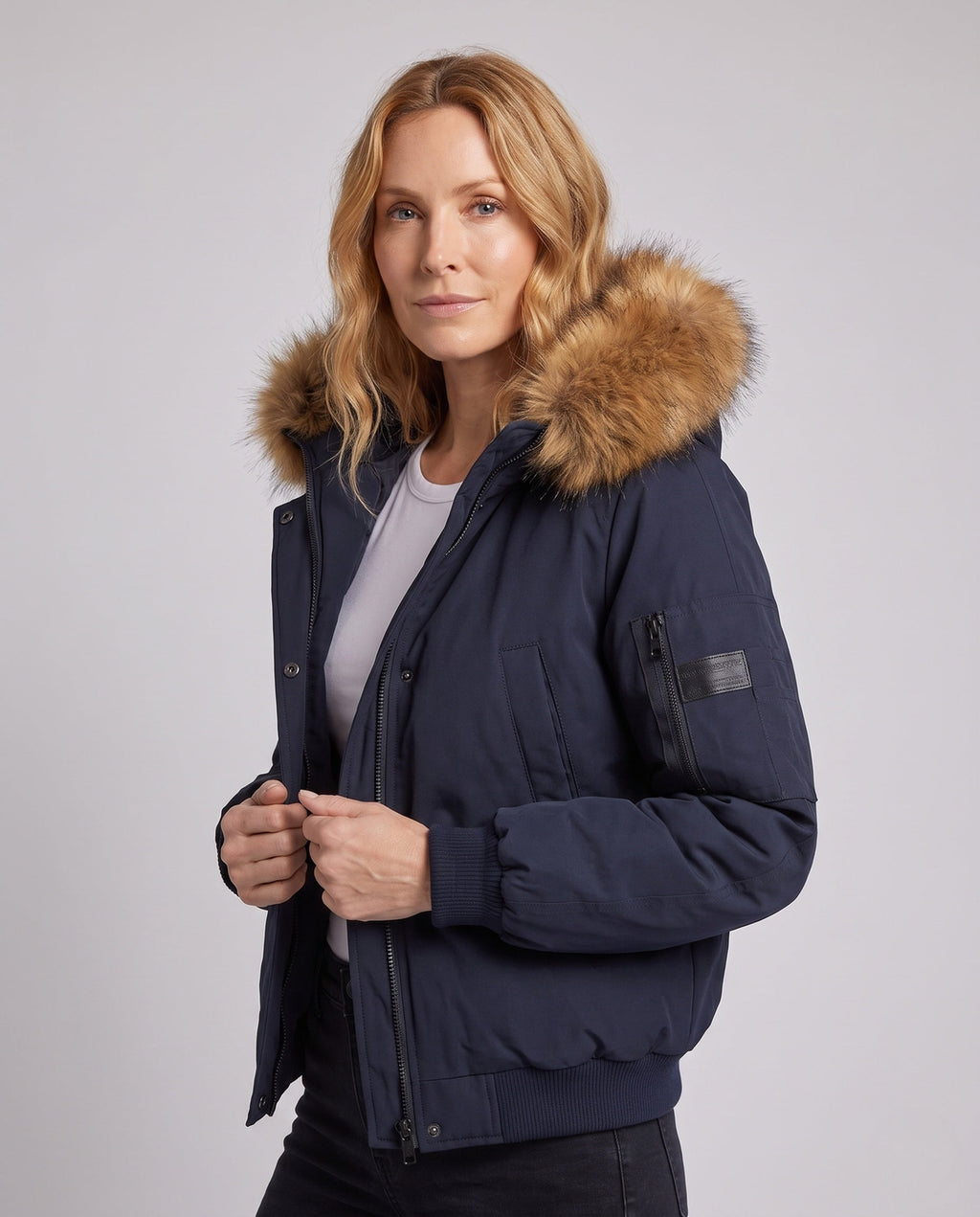 Women's short urban thermal parka with detachable faux fur trim, raglan sleeves, and concealed two-way zipper