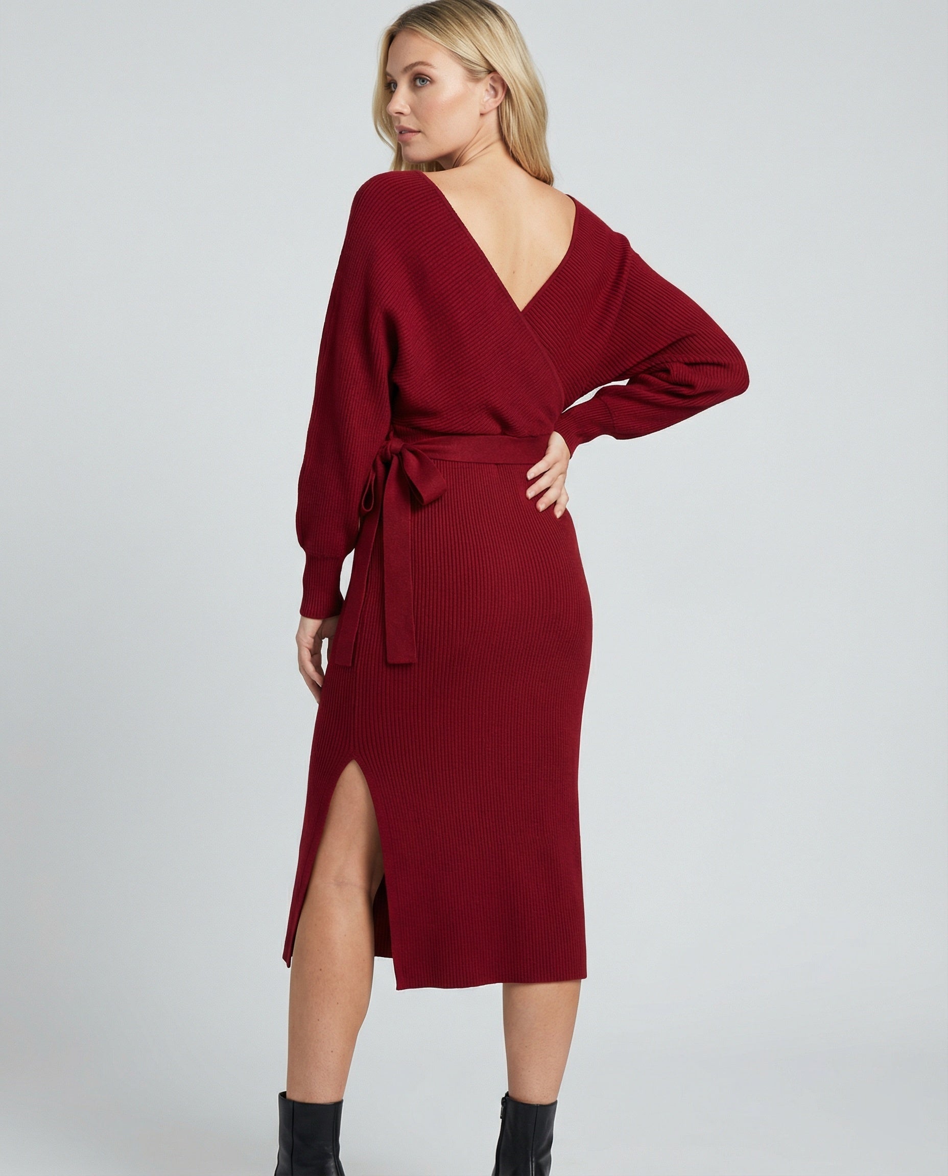 Women's knitted dress with elegant wrap design and decorative belt