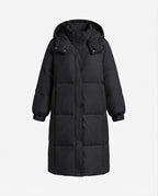 Women's longer minimalist padded coat with high wrap collar and straight square quilting seams
