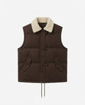 Women's short-cut suede look quilted vest with teddy collar, toggle closures, and drawstring hem