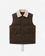 Women's short-cut suede look quilted vest with teddy collar, toggle closures, and drawstring hem