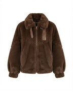 Women's cozy faux fur jacket with stand-up collar, zippered pocket and feminine balloon sleeve silhouette