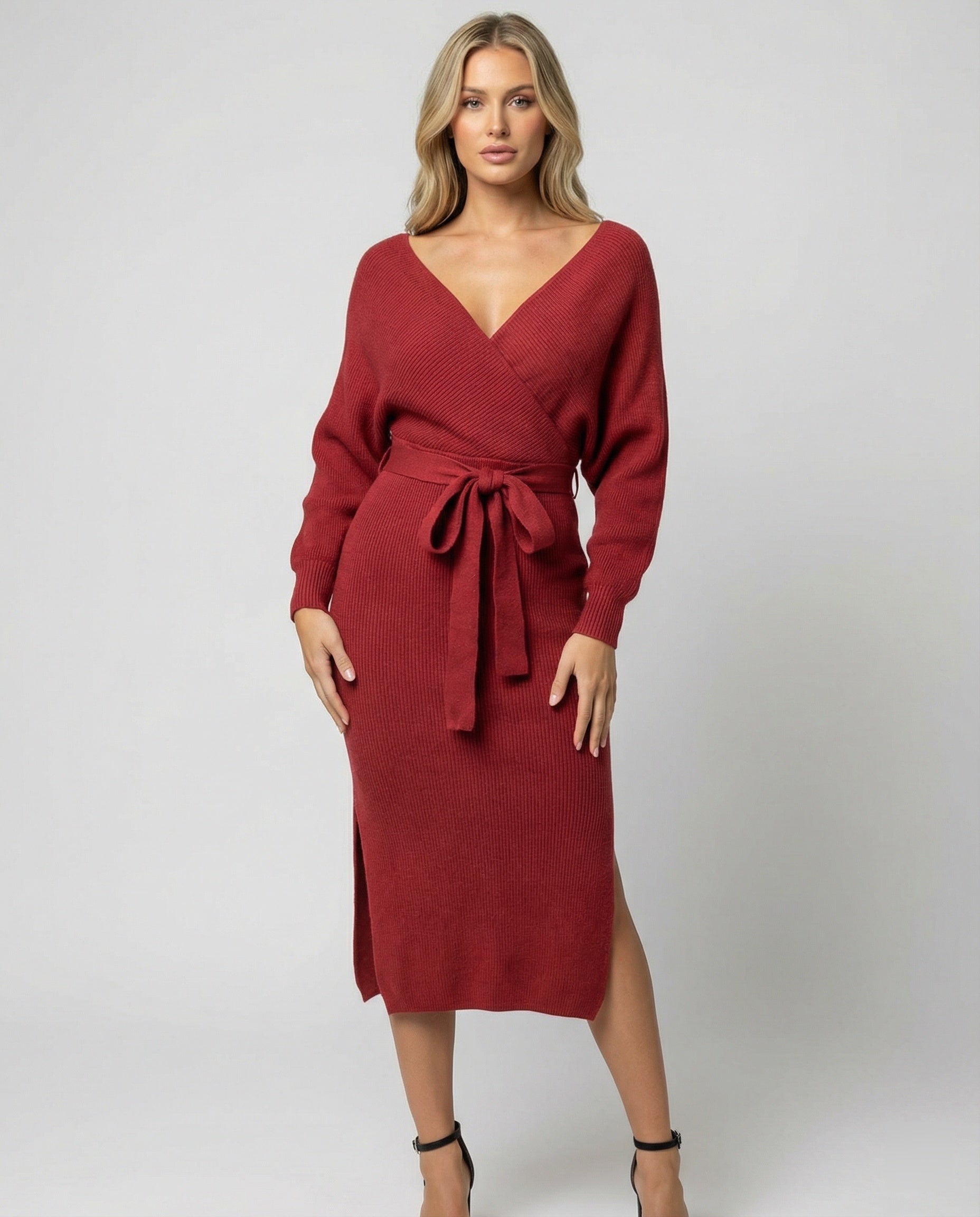 Women's knitted dress with elegant wrap design and decorative belt