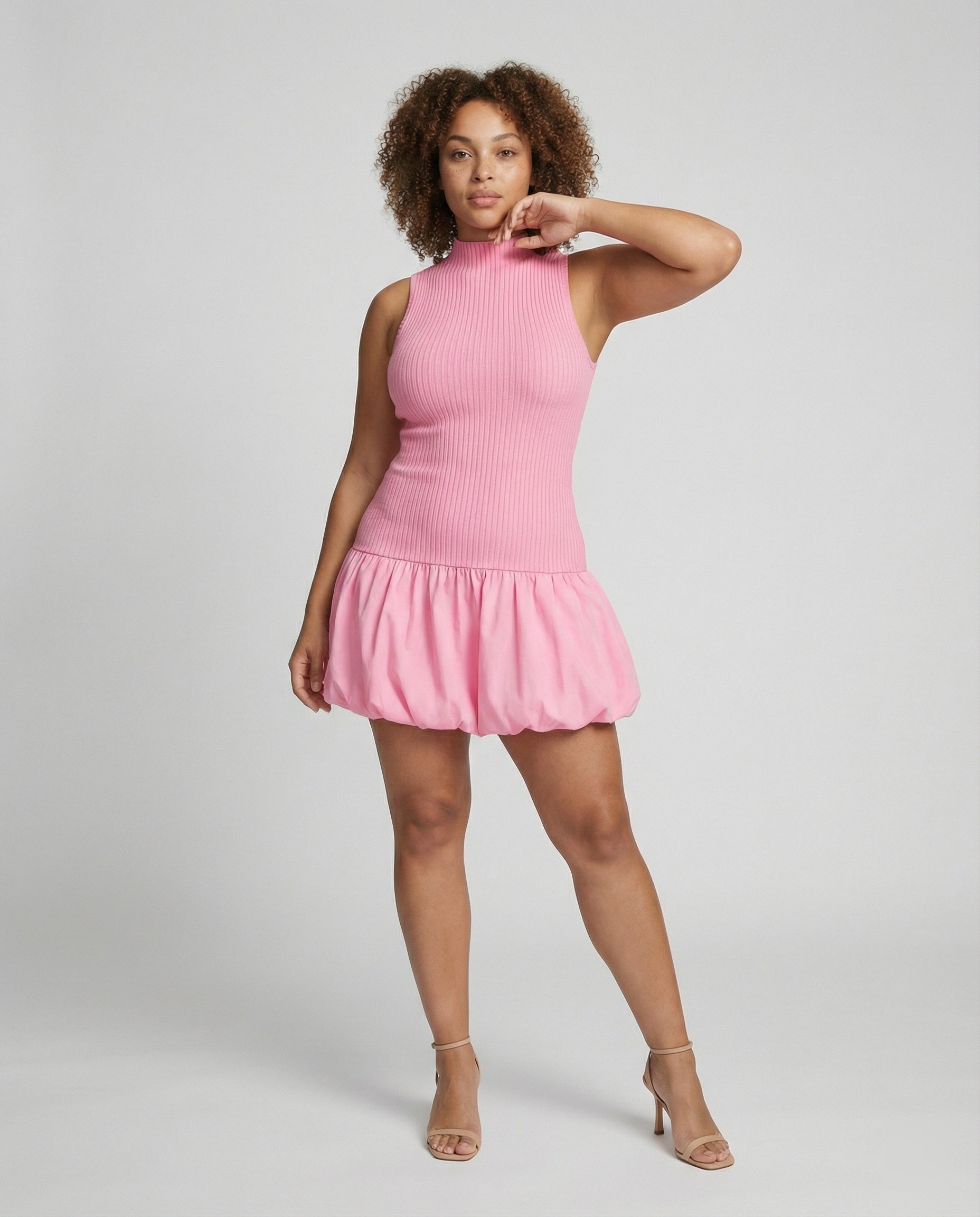Women’s dress with sleeveless, figure-hugging top and voluminous skirt
