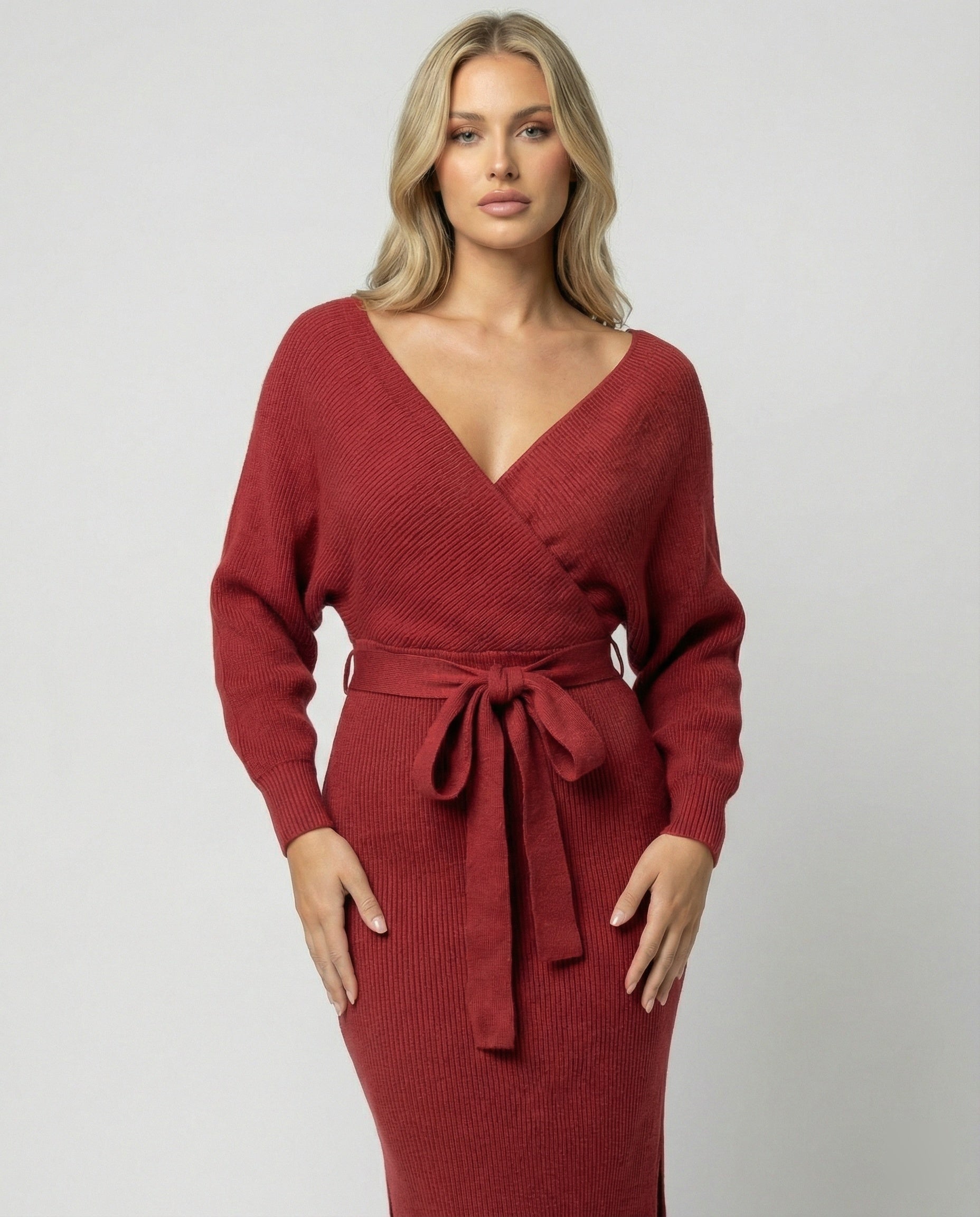 Women's knitted dress with elegant wrap design and decorative belt